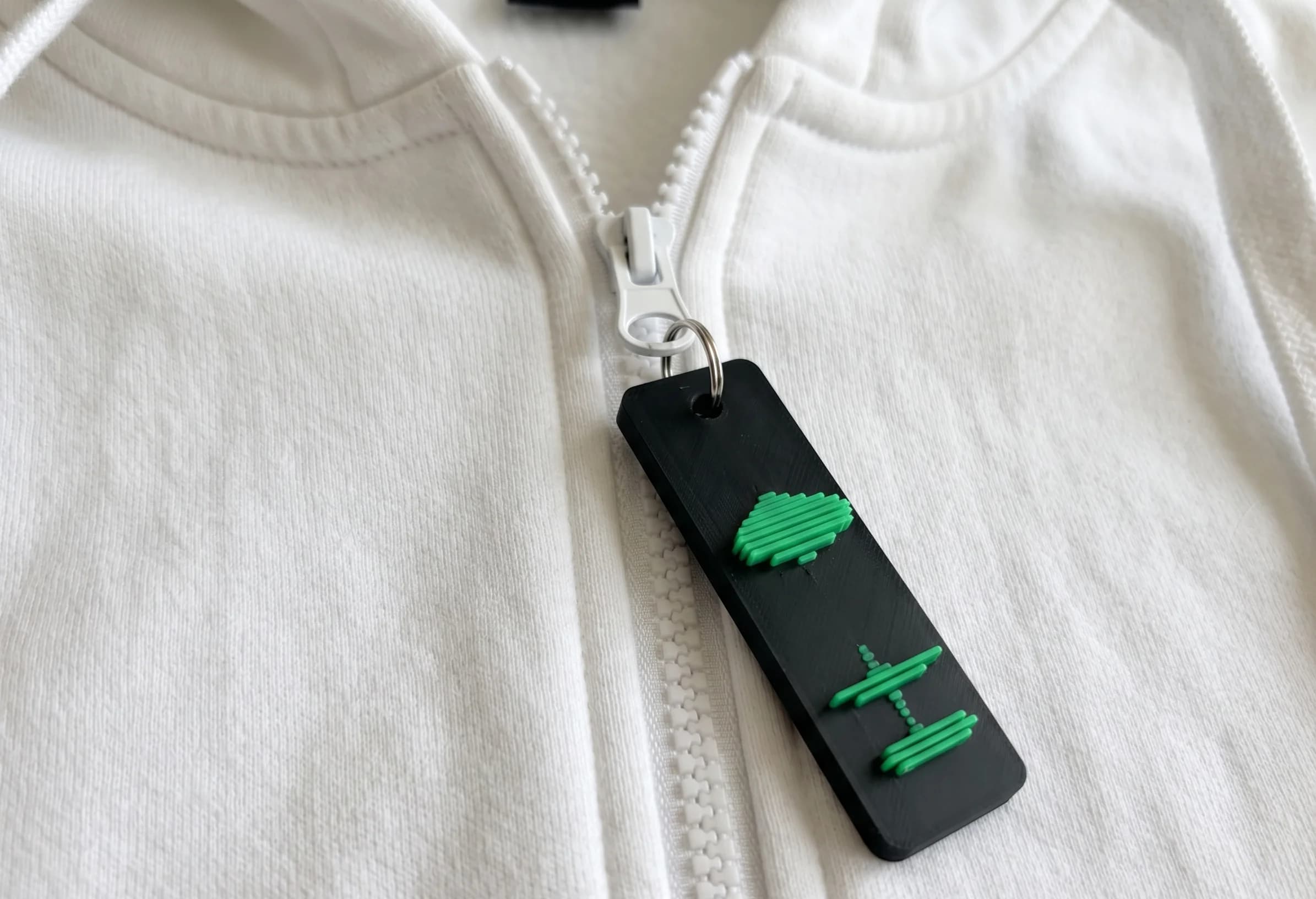 VoicePrint3D keychain on a hoodie
